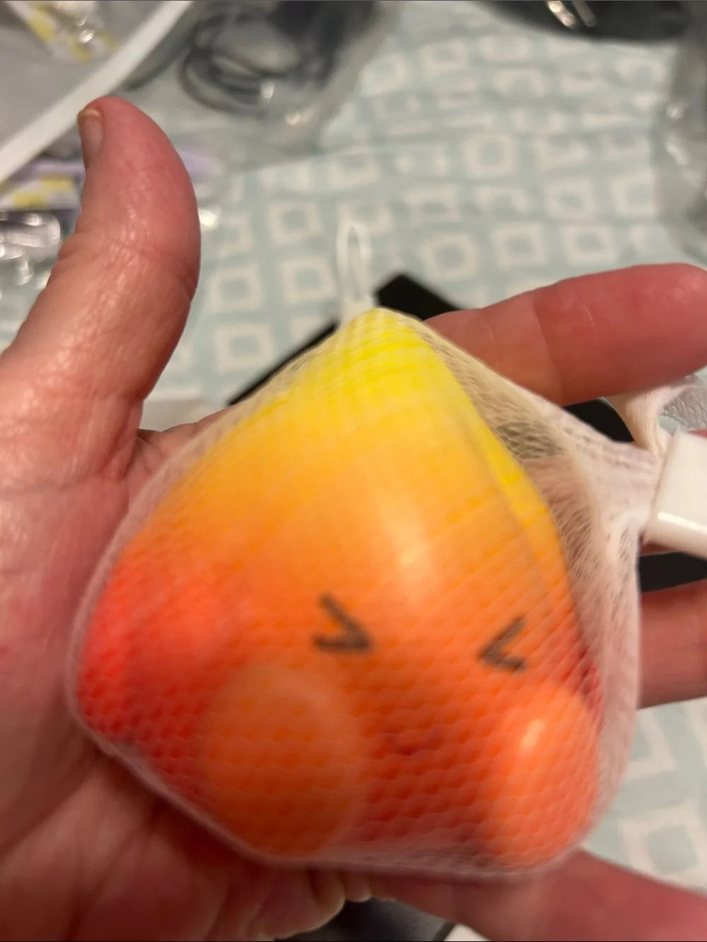Source Unknown yellow squishy charm